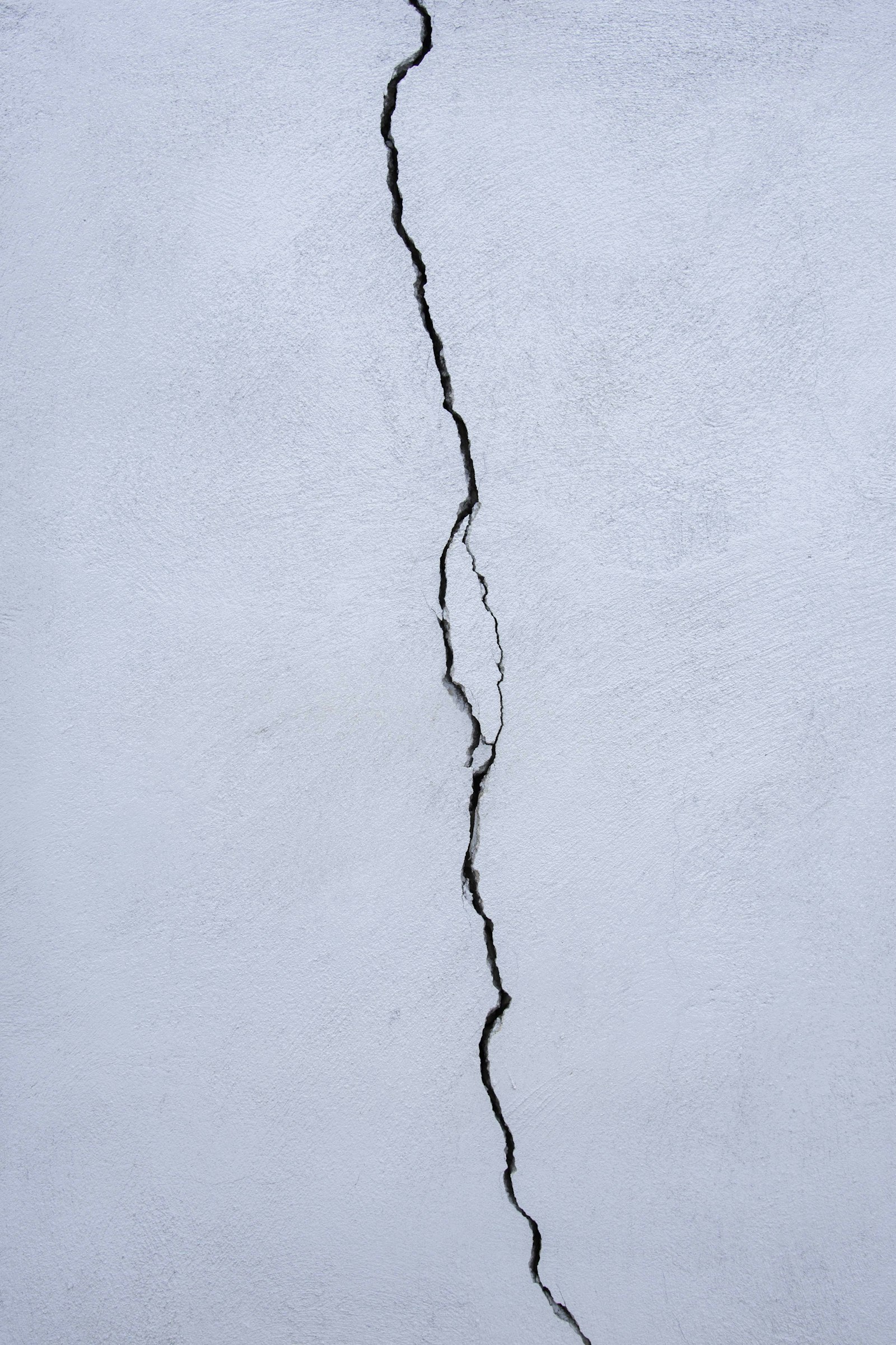 Thin diagonal crack in a plastered wall